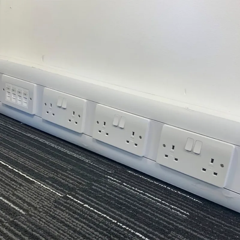 Run of office sockets and data points installed along skirting