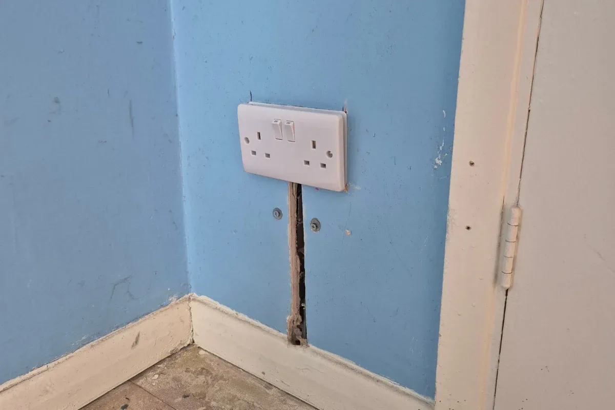 New double socket fitted to a chased wall during a rewire