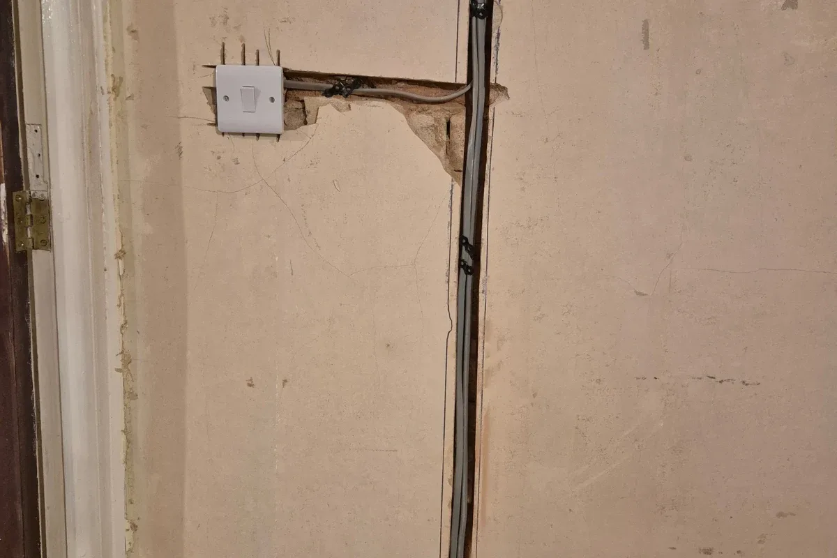 New light switch wired in with cables run through fresh wall chases