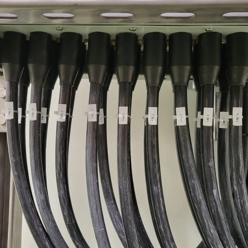 Heavy-gauge cables neatly labelled and glanded into an industrial cabinet